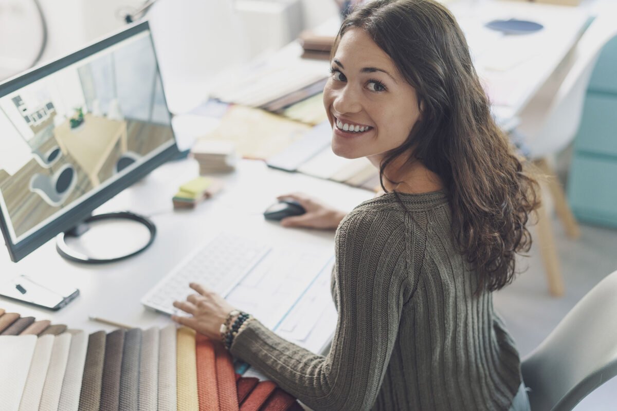 smiling interior designer working at desk 2022 01 19 00 21 44 uf935mr.jpg